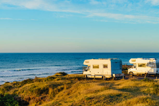 istock Camper rv camping on sea shore, Spain 1369991432