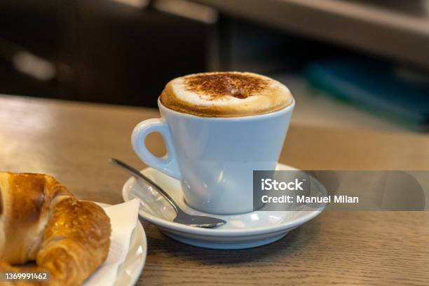 Cappuccino Cup And Croissant For Breakfast In A Coffee Shop Stock Photo - Download Image Now