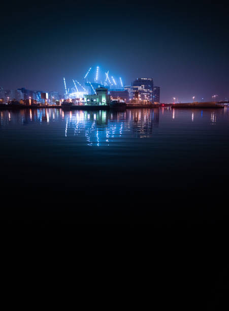 istock Dubai Creek with illuminated buildings and cranes 1369992824