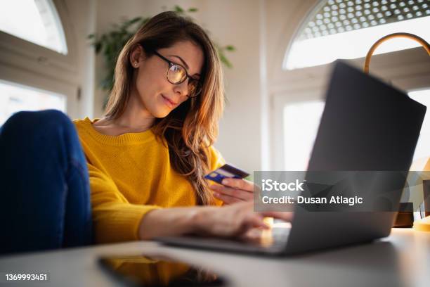 Beautiful Young Woman Working At Home Stock Photo - Download Image Now - Credit Card, Women, One Woman Only