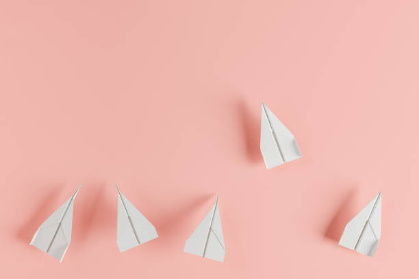 istock paper airplanes advancing with a more advanced one 1369993739