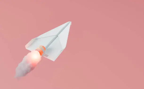 Photo of paper airplane with propeller releasing fire