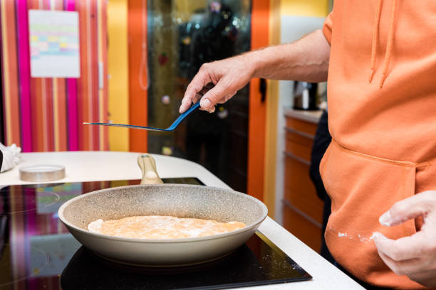 istock Man Making Traditional Roti Chapati Flatbread at Home 1369996629