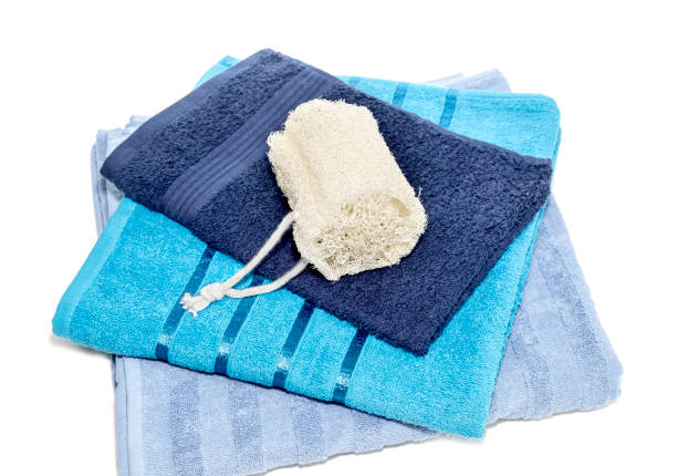 items on a fluffy white towel ready for a relaxing bath