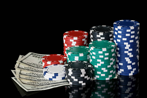istock poker chips with cash 136999756