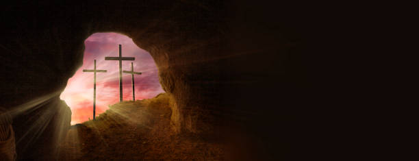 istock Open Tomb At Sunrise With Grave Clothes And Three Crosses 1370001042