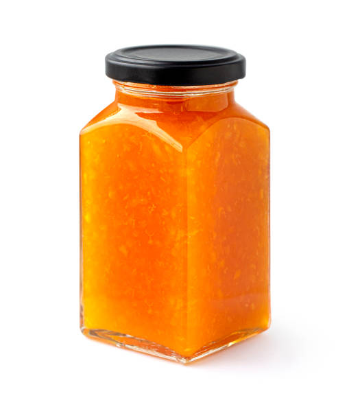 istock faceted Jar of Apricot or peach jam 1370001050