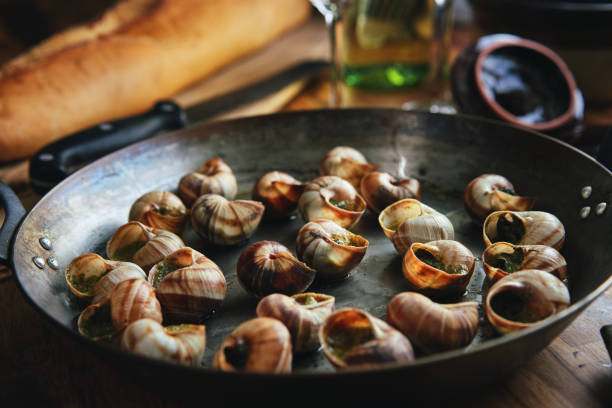 istock Preparing French Escargot Snails with Herb Butter 1370003370