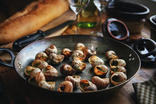 istock Preparing French Escargot Snails with Herb Butter 1370003377