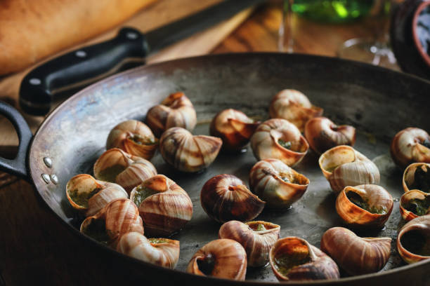istock Preparing French Escargot Snails with Herb Butter 1370003406