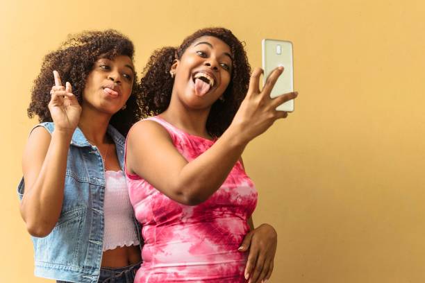 istock Two young women taking a selfie. 1370004652