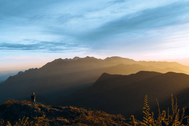 Man at sunset in Mantiqueira Mountains, Brazil Man at sunset in Mantiqueira Mountains, Brazil. mantiqueira mountains stock pictures, royalty-free photos & images