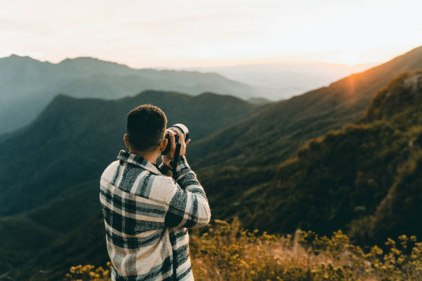 istock Professional photographer in the mountains 1370008117