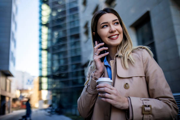 istock Young Business woman using smart phone having a conversation 1370009765
