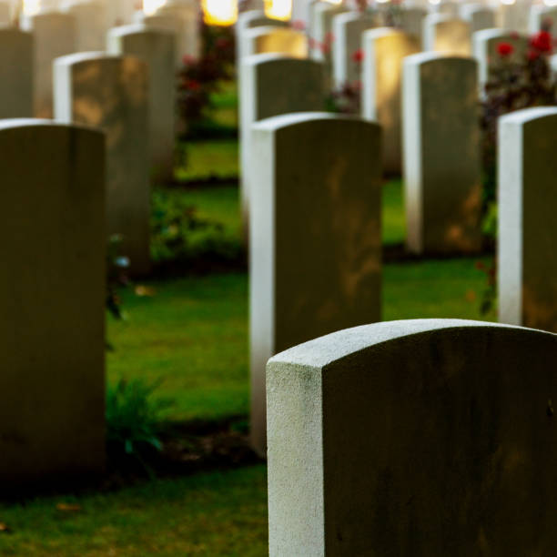 istock concrete graves on cementery rest in peace 1370011064