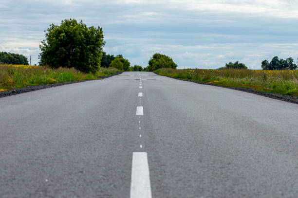 istock Road in the countryside on sunset 1370011271