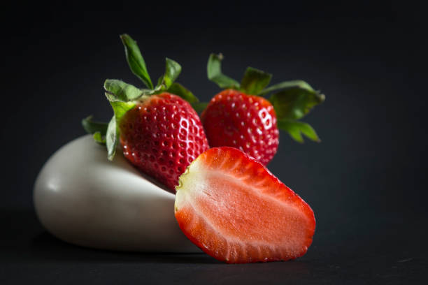 istock strawberries served in an original way, in the foreground half a strawberry 1370012058