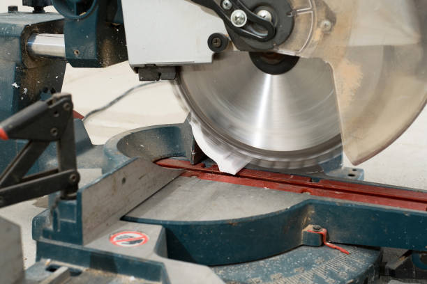 istock Circular saw with a sharp rotating blade, cuts new baseboard, equipment for renovation and construction. Working circular saw at construction site 1370014229