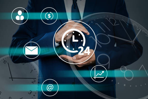 istock Time management concept. Man with clock surrounded by icons, closeup 1370014895