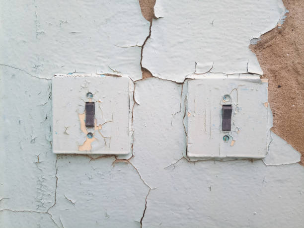 istock Switches on the old wall. Very old house 1370015568