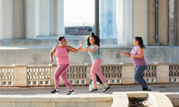 istock Three multiracial women running on city waterfront 1370016093