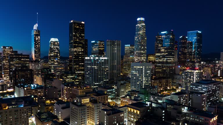 Time lapse shot taken by a drone flying over Downtown Los Angeles from sunset to full dark.