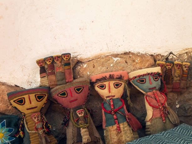 Ancient Prehispanic doll from Cusco, Peru made of old fabric on white background