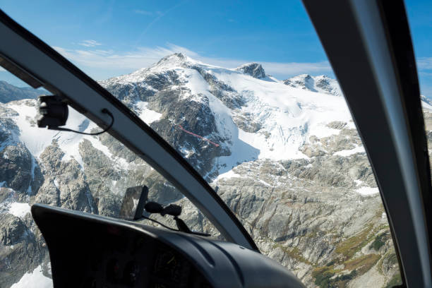 istock Helicopter flight in the mountains 1370019770