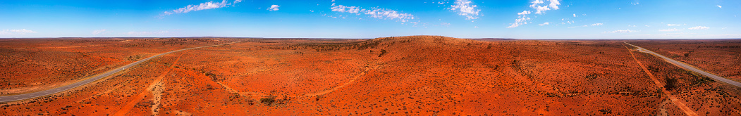 Endless red soil outback of Australia along Barrier highway from Broken hill at Dolo hill rest stop.