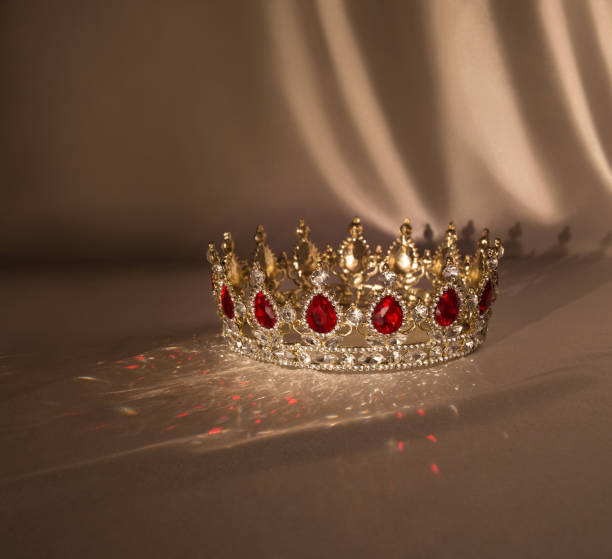 istock Crown with red gemstones. Ruby, garnet. Symbol of success 1370025658