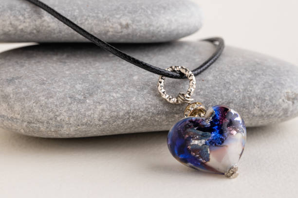 istock Heart pendant on gray stones. 1370025970