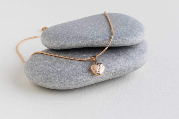 istock White pearls on a gray stone 1370026602