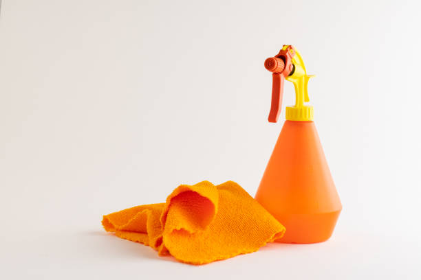 Watercolor spray bottle with cleaning cloth. Solution for home hygiene