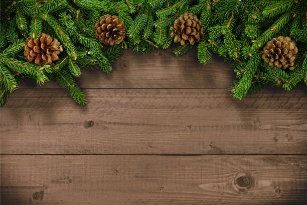 istock Wood background with fir branches and pine cones for Christmas or celebrations with copy space 1370031447