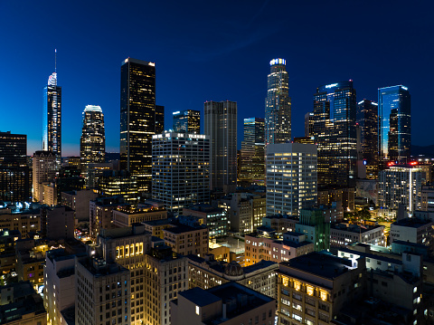 Aerial shot of Downtown Los Angeles at twilight, looking over the Historic Core towards financial district skyscrapers on Bunker Hill.