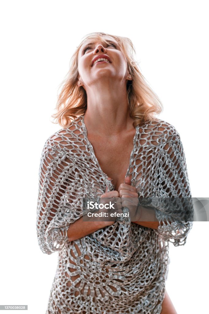 Happy blonde woman in fishnet outfit Happy blonde woman posing in a fishnet top on white background 35-39 Years Stock Photo