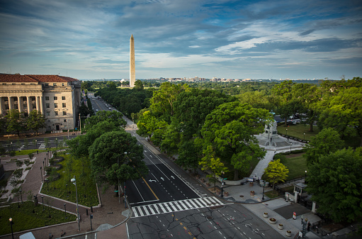 High angle view looking down on 15th St NW in Washington, DC and the General William Tecumseh Sherman Monument, towards the Washington Monument and Thomas Jefferson Memorial.