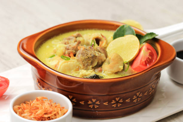istock Close Up Empal Gentong Cirebon. Traditional Beef in Coconut Milk Soup from Cirebon, West Java. Served on Brown Ceramic Bowl 1370038292