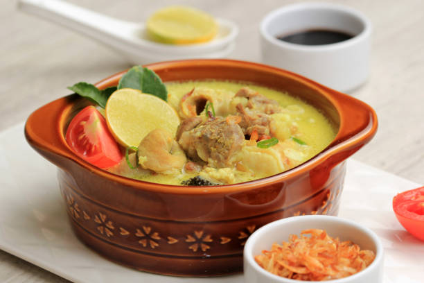 istock Close Up Empal Gentong Cirebon. Traditional Beef in Coconut Milk Soup from Cirebon, West Java. Served on Brown Ceramic Bowl 1370038319