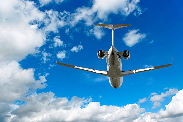 istock corporate jet airplane flying in cloudy sky 137004082