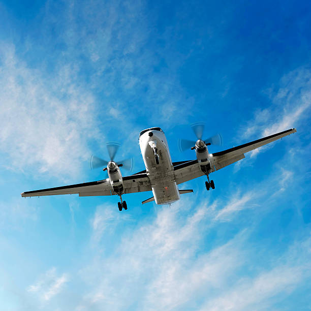 istock propeller airplane landing in bright sky 137004156
