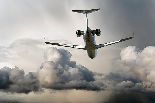 istock corporate jet airplane flying in storm 137004193