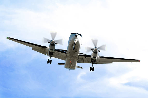 istock propeller airplane landing in bright sky 137004196
