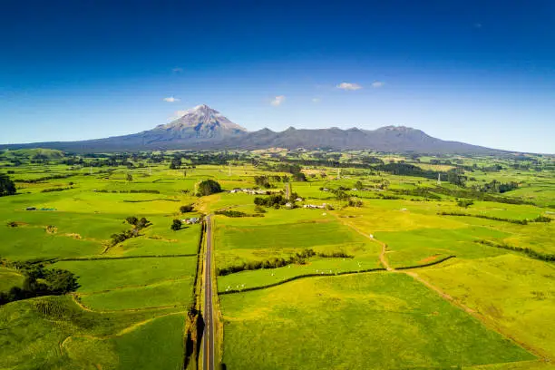 Aerial view of road leading to mount Taranaki in New Zealand