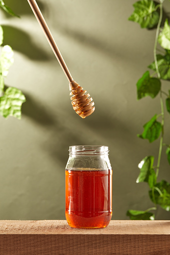 Dripping Honey to Jar