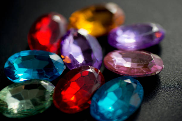 Collection of gems and precious stones stored in a ceramic bowl