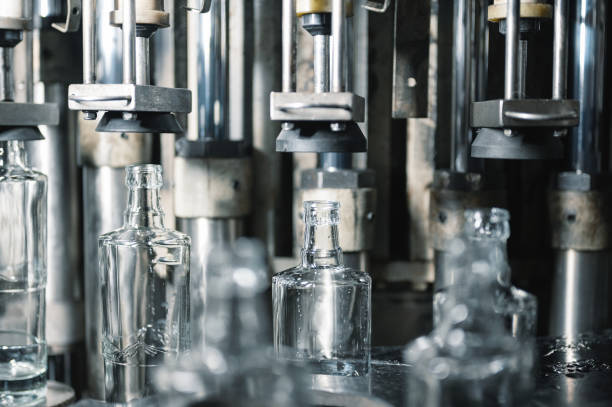 istock Automatic production line fills glass bottles with vodka 1370051899