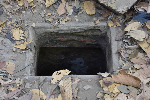 istock Vietcong Tunnel Entrance at Cu Chi Tunnels 1370055235