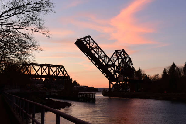 Raised Bridge at Sundown Salmon Bay Bridge in the Ballard neighborhood of Seattle, Washington ballard-seattle stock pictures, royalty-free photos & images