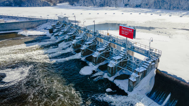 istock Flowing water from the open dam in winter 1370060175